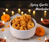 Bowl of Spicy Garlic Murkuku with decorative lights and flowers on a dark background